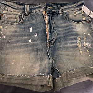 Anthropologie light faded blue Jean shorts.
